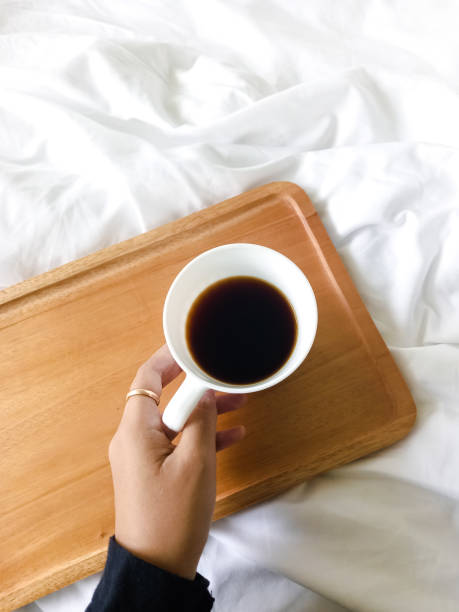 istock Enjoying morning coffee in bed 1458818160