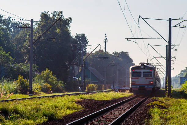 istock Suburban passenger trains is moving along the railroad. 1458819986