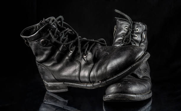 istock A pair of worn men's leather boots on a black 1458819987