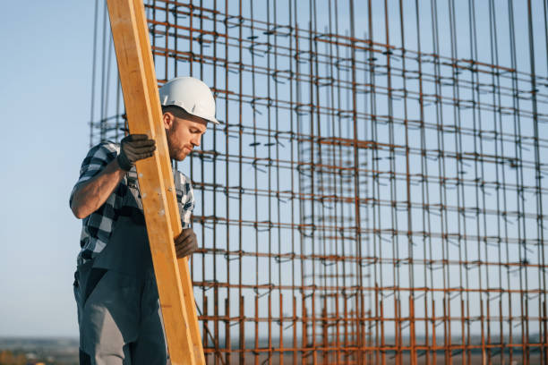 istock Standing near steel frame. Man is working on the construction site at daytime 1458820608