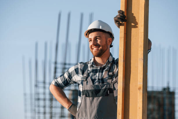 istock Standing and posing. Man is working on the construction site at daytime 1458820726