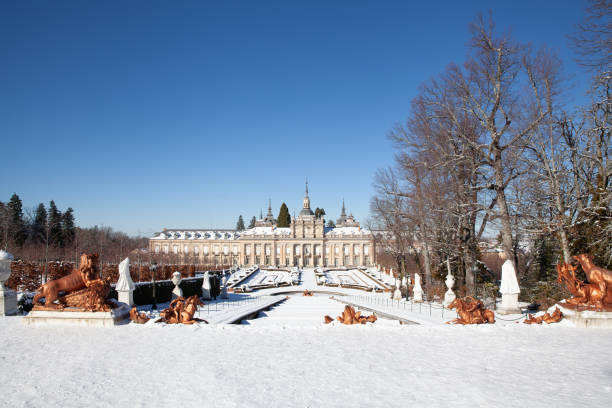Segovia, Spain - 4 January 2022: Royal Palace of La Granja de San Ildefonso covered with snow on a sunny day in winter
