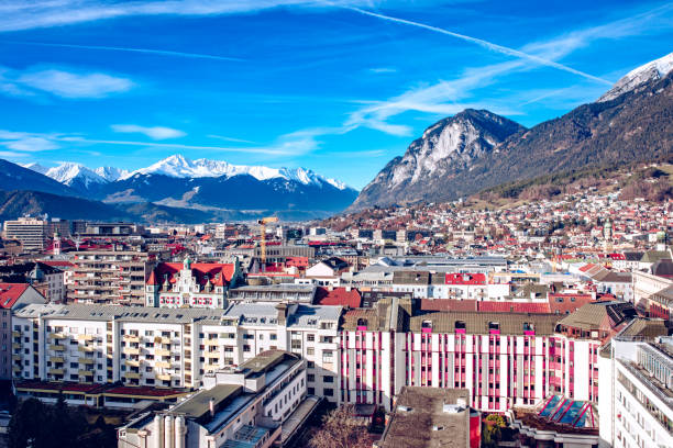 the capital of austria’s western state of tyrol. view of the alps and the famous bergisel ski jumping tower. - inn history built structure architecture imagens e fotografias de stock