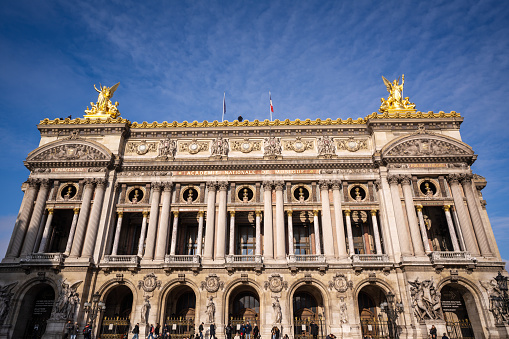 Paris, France - December 10, 2022: Daytime view of the Palais Garnier, Opera in Paris, France. It is a 1,979-seat opera house, which was built from 1861 to 1875 for the Paris Opera.