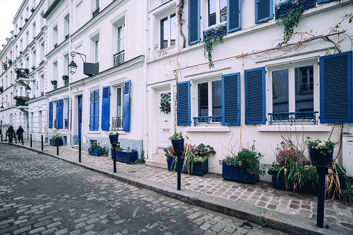 Montmartre in Paris,  building with blue shutters\nParis, France
