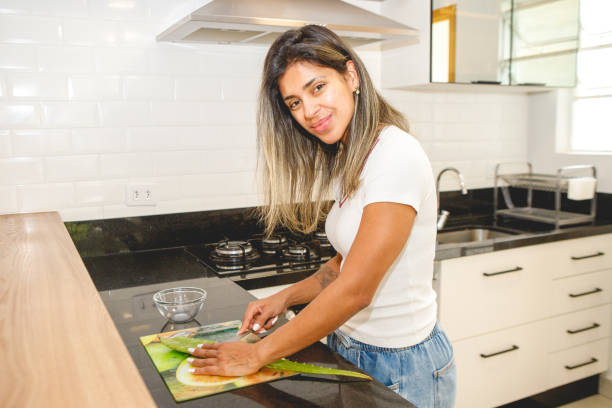 istock woman preparing aloe vera for cosmetic use 1458823400