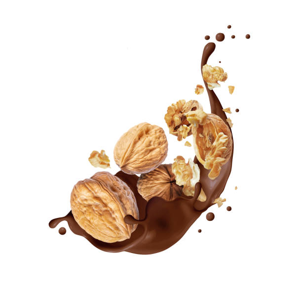 istock Crushed walnuts in chocolate splash isolated on a white background 1458824799