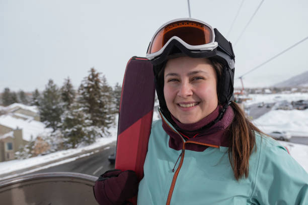 istock Girl ready to go skiing in lift 1458828588