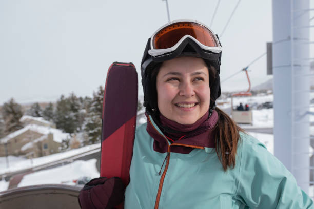 istock Girl ready to go skiing in lift 1458828594