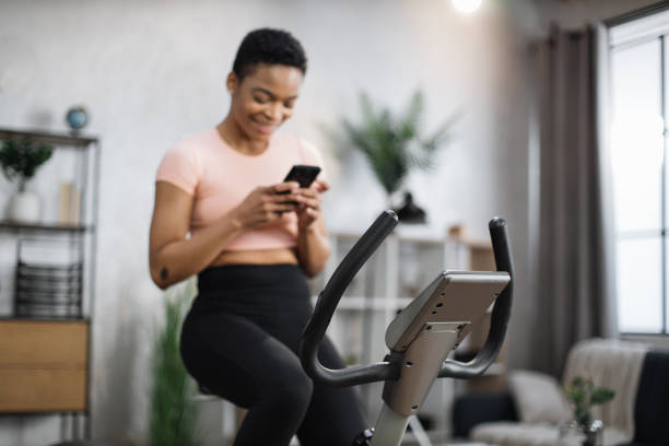 istock Focus on screen connected online to live streaming subscription service for biking exercise. 1458829611