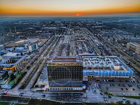 A look over Milton Keynes at sunset. The cities tallest building Hotel La Tour in the foreground and a look down the length of the shopping centre