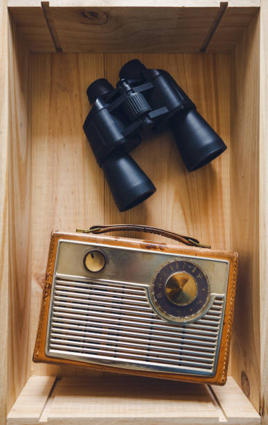istock Binoculars and old Radio 1458834858