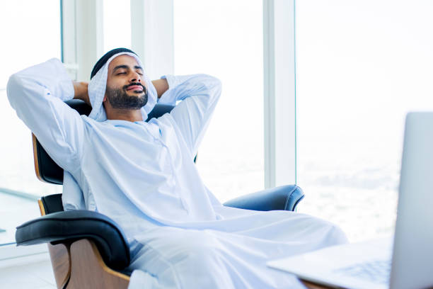 istock Arab man with beard relaxing on armchair in modern office 1458836160