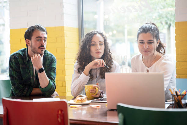 istock University students team studying together on a new project in creative coworking classroom - Bright filter with focus on woman on center 1458836275