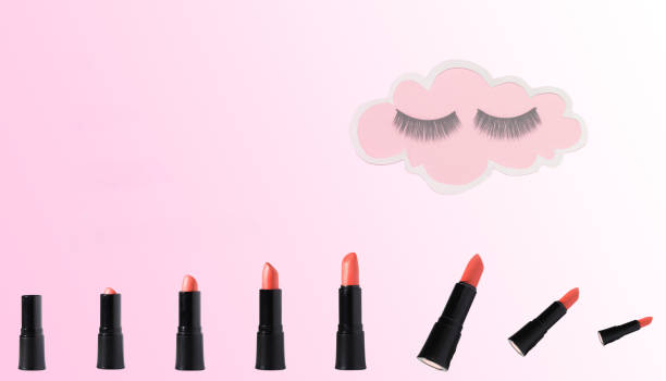 istock lipsticks at the bottom of the background isand cloud with lady eyelashes, creative design photo cosmetic salon 1458836449