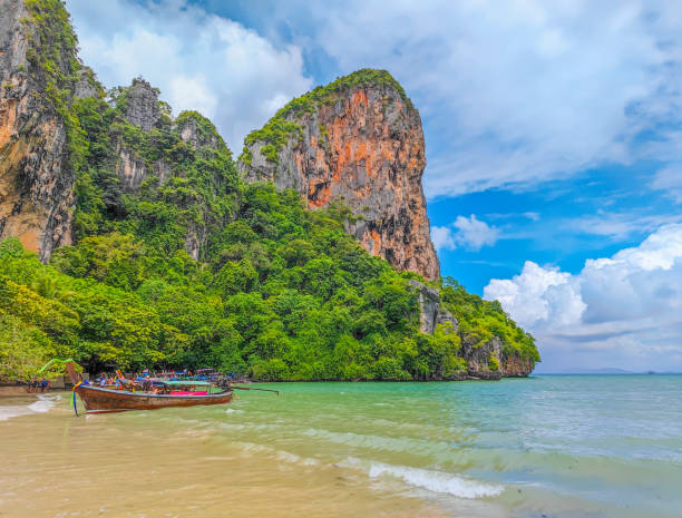 istock Exotic Railay beach in Thailand with long tail boats parked 1458840152