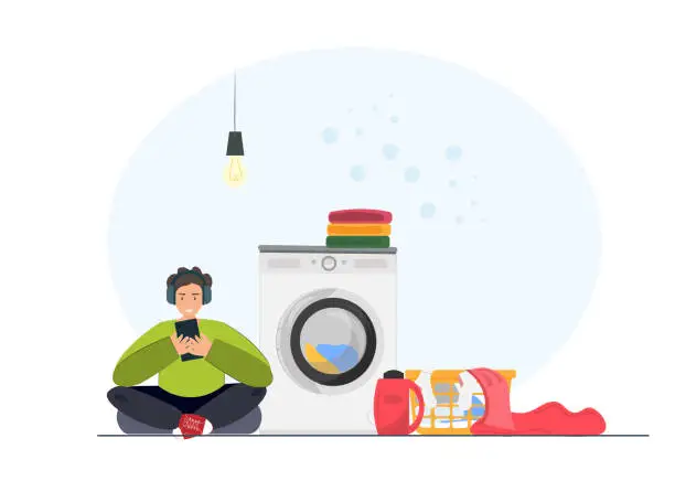 Vector illustration of Man sitting in the laundry room listening musing with washing machine, clothes, towels, household concept, flat vector illustration