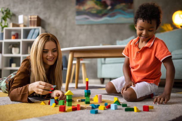 istock Boy and mom playing together 1458847466