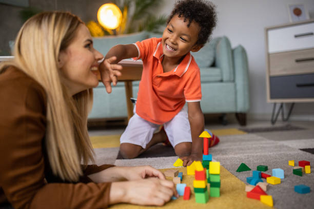 istock Boy and mom playing together 1458847611