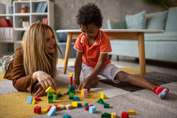 istock Boy and mom playing at home 1458847667