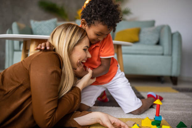 istock Boy and mom playing at home 1458847718