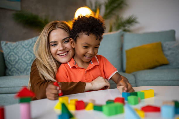 istock Mother and son playing together 1458848281