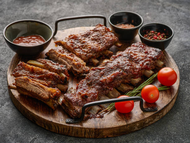istock Delicious smoked pork ribs glazed in BBQ sauce. 1458848289