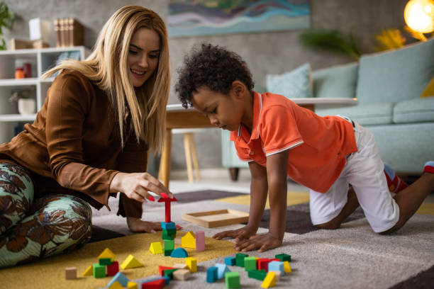 istock Boy and mom playing together 1458848881