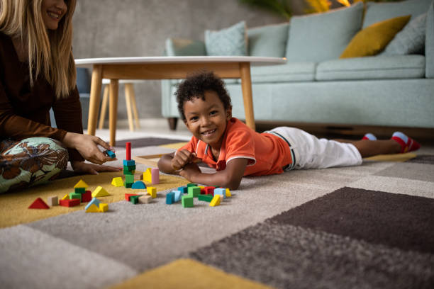 istock Boy and mom playing together 1458848993