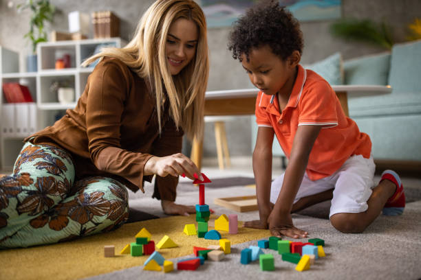 istock Boy and mom playing together 1458849031