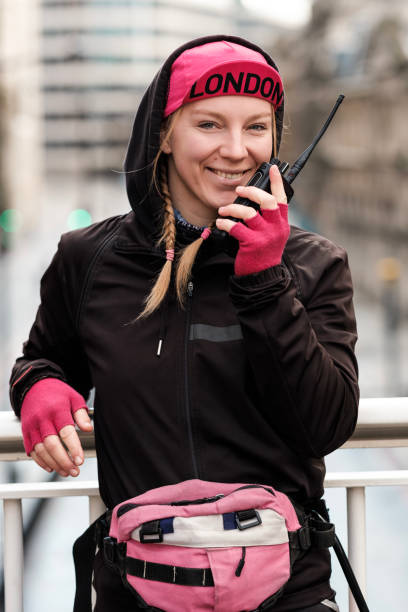 istock Smiling bike courier woman looking at camera. 1458849382