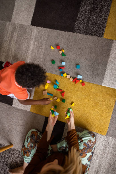istock Mom and son playing at home 1458849679
