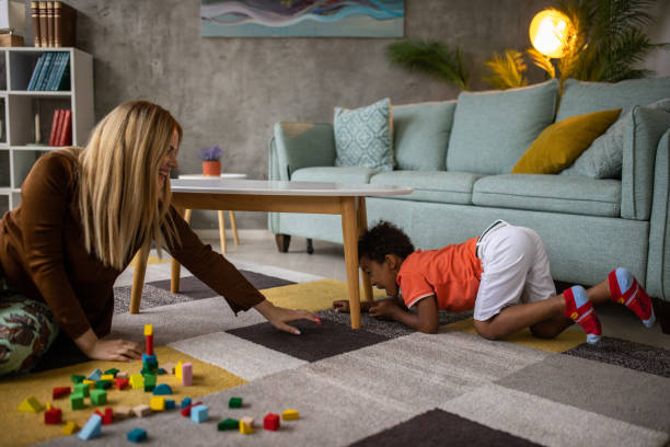 istock Boy and mom playing at home 1458849853