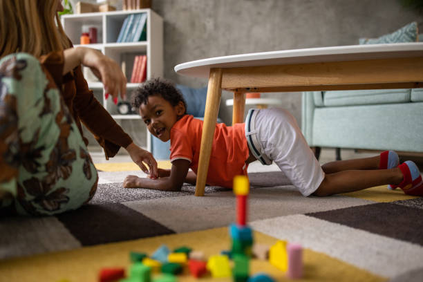 istock Boy and mom playing at home 1458849890