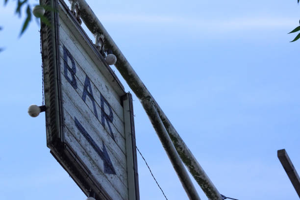 istock Low angle view of sign to a bar 1458850046