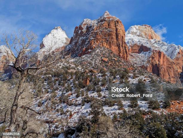 View Of Bridge Mountain And The Sentinel Peak After Snowfall Near The Human History Museum In Zion National Park Utah In Winter Stock Photo - Download Image Now