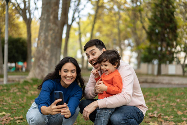 istock Couple with son grimacing in the park 1458851587