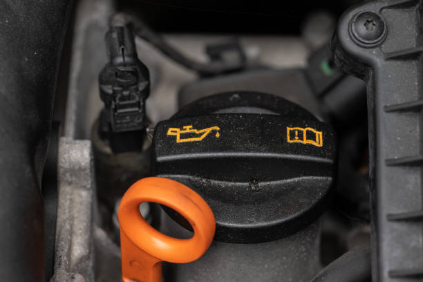 istock Oil filler cap on a car engine. 1458854864
