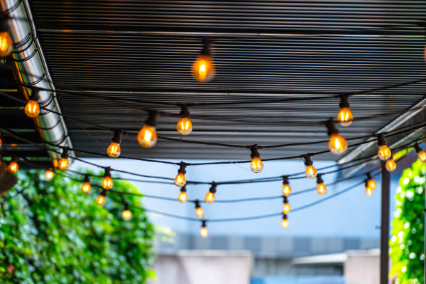istock decorative light bulbs hanging from the roof. 1458854943