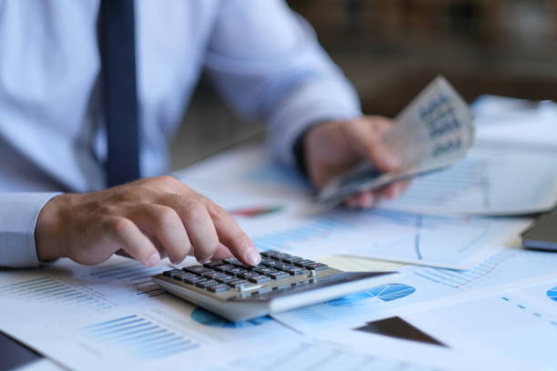 istock Businessman Calculating 1458862751