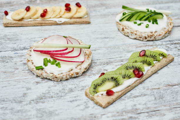 istock Rice cake and crispbreads with cream cheese and vegetables 1458862784