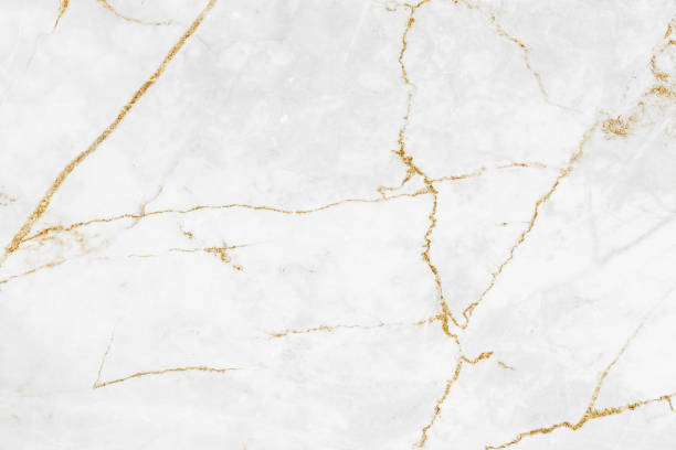 istock White and gold marble luxury wall texture with shine golden line pattern abstract background design for a cover book or wallpaper and banner website 1458862958