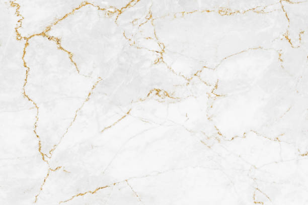 istock White and gold marble luxury wall texture with shine golden line pattern abstract background design for a cover book or wallpaper and banner website 1458862971