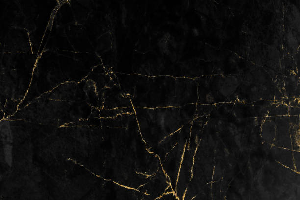 istock Black and gold marble luxury wall texture with shiny golden line pattern abstract background design for a cover book or wallpaper and banner website 1458864542