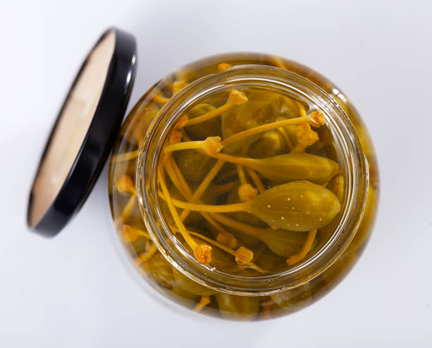 istock Glass jar with pickled green capers 1458875728