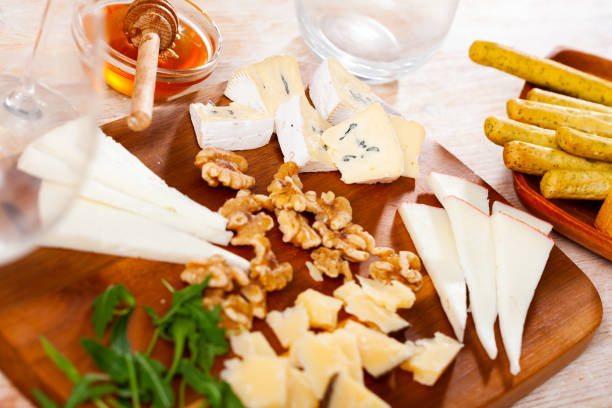 istock Cheese board served with honey on wooden table 1458875881