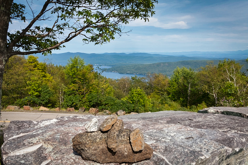 A  peaceful view of Lake George from the top of Prospect Mountain , New York. Lake George is located on the southern end of the Adirondack Mountains. The lake is 32 miles long and is one of the cleanest lakes in the area. Prospect Mountain is located in Warren Township , New York.