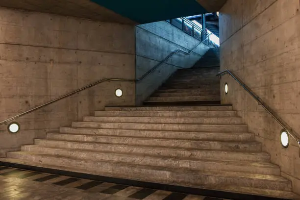 Staircase in underground passage in modern city space. Exit