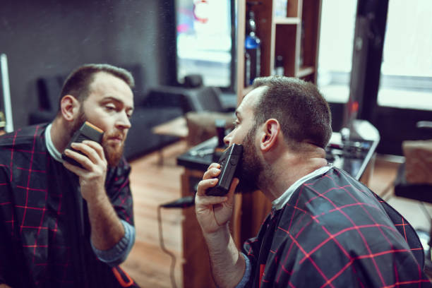 istock Cheek Beard Trimming By Male With Machine 1458893427