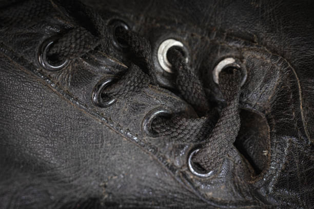 Extreme close-up of the shoelaces on a pair of vintage baseball cleats.